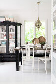 Old display case in vintage-style, black-and-white dining room