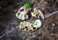 Slices of various unleavened Indian bread with dips