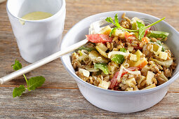 Fruity and spicy spelt salad with cheese and apple, peppers, gherkins and cream dressing