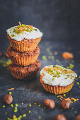 Carrot muffins with cream cheese, hazelnuts, honey and pistachio nuts