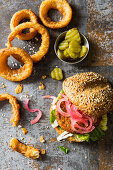 Veggie Vegan Burger made with cauliflower beans and pickled red onions and fried onion rings