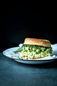 An English muffin with avocado-and-egg salad and cress