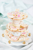 Easter biscuits on cake stand made from vintage crockery