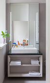 Washstand with countertop sink in bathroom