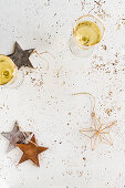 Two glasses of champagne and christmas decoration stars