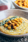 Butternut squash cream with spicy chickpeas and pumpkin seeds