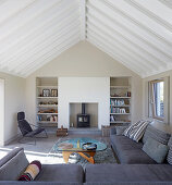 Grey sofa combination, coffee table and log burner in living room