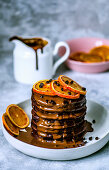 Chocolate pancakes with chocolate drops and chocolate sauce