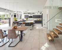 View into kitchen area in modern, open-plan interior