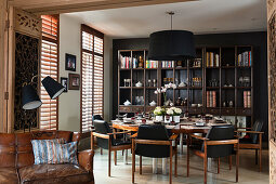 Open doorway into dining room with round set table