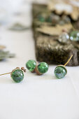 Autumnal arrangement of acorns handmade from marbles on table