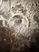 Flour on a wooden surface