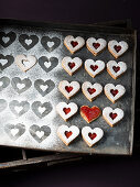 Linzer heart biscuits with jam and powdered sugar