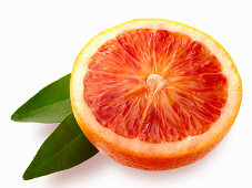 Blood orange half with leaves