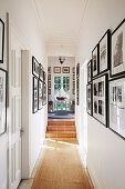 Aisle escape in beach house with a view of picture walls and model ship