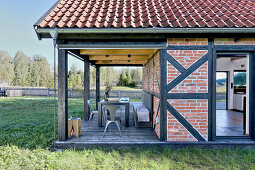 Barn converted into home with roofed terrace