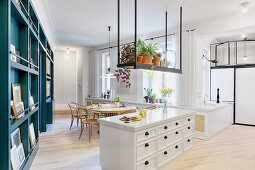 Kitchen and dining room in open-plan interior in converted tenement