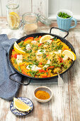 Paella with fish, pepper and green beans