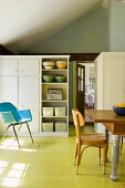 Country-house-style kitchen-dining room with lime-green floor