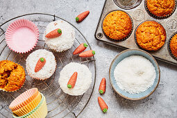 Carrot muffins with white chocolate, grated coconut and marzipan carrots