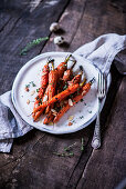 Baked carrots with a honey-thyme glaze and almond flakes