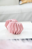 Ornaments made from folded pink paper