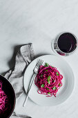 Spaghetti with beetroot pesto served with red wine