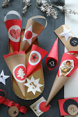 Handmade red and beige paper cones for Advent calendar