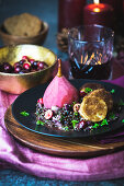 Lentil salad with cranberries, mulled wine pears and goat's cheese in a gingerbread crust