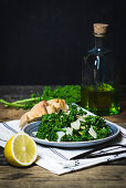 Kale salad with lemons, olive oil, pine nuts and Parmesan