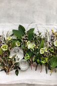 Hellebores, pussy willow and olive branches