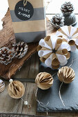 Handcrafted Christmas decorations: small, paper honeycomb balls and rosettes for hanging up