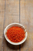 Red lentils in a wooden bowl