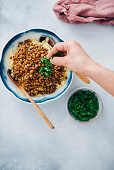 Pasta with lentil and chopped parsley