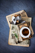 Old newspaper, gift, book, cup of coffee and flower