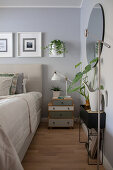 Scandinavian-style bedroom decorated in grey, white and green