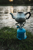 A coffee pot on a camping stove