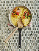 Scrambled eggs with tomatoes, ham and cheese