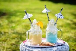 Frappes in two glasses, decorated with little umbrellas