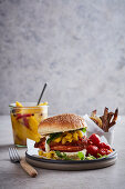 A chicken burger with pickled mango