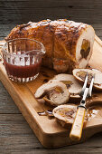 Glazed turkey breast stuffed with ham dates and walnuts