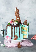 An Easter cake decorated with a chocolate bunny, sliced