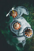 Three chocolate espresso cakes in a garden