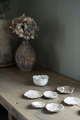 White clay shells on wooden table