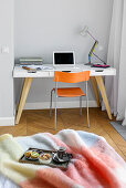 Breakfast tray on bed and desk in bedroom