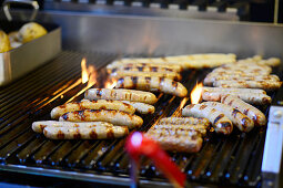 Sausages being grilled