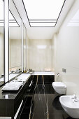 Elegant bathroom with black marble elements
