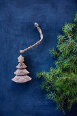 A mini carved Christmas tree decoration