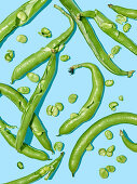 Green beans on a light blue surface