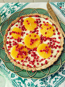 Orange tart with pomegranate seeds